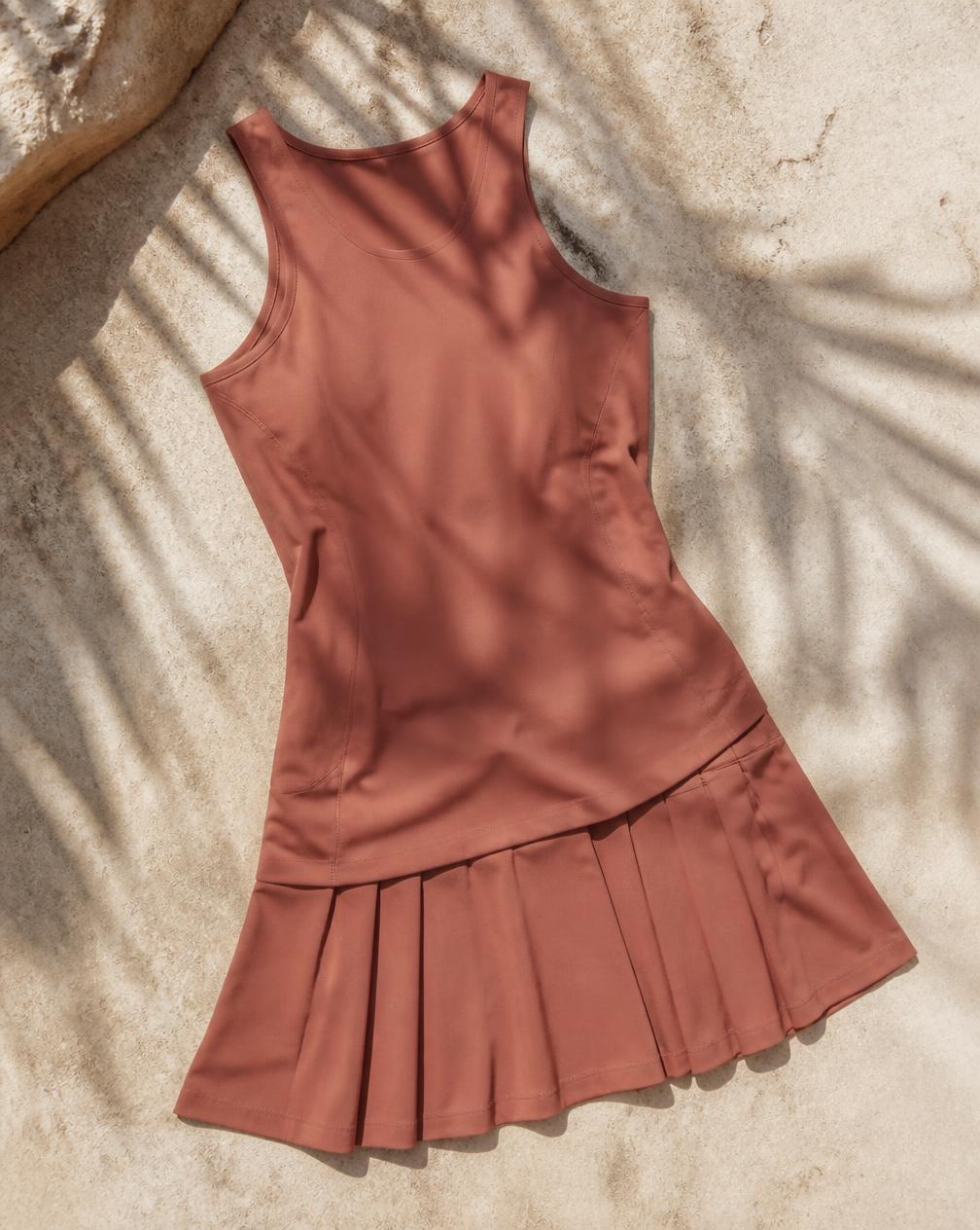 Temporary concept image of a muted clay tennis dress