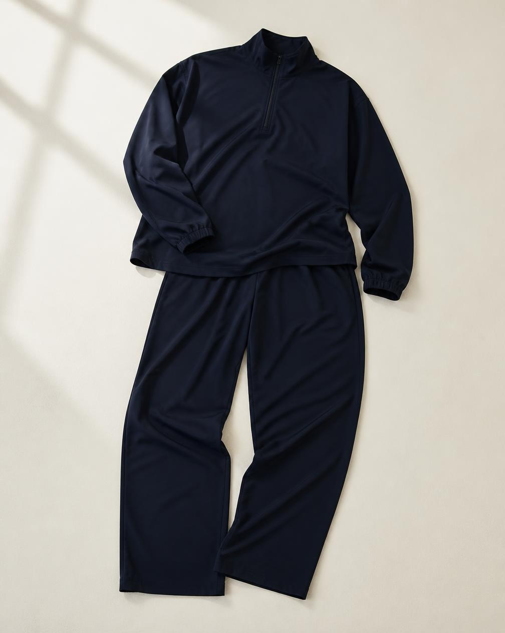 Temporary concept image of a deep ink warm-up top and active pants